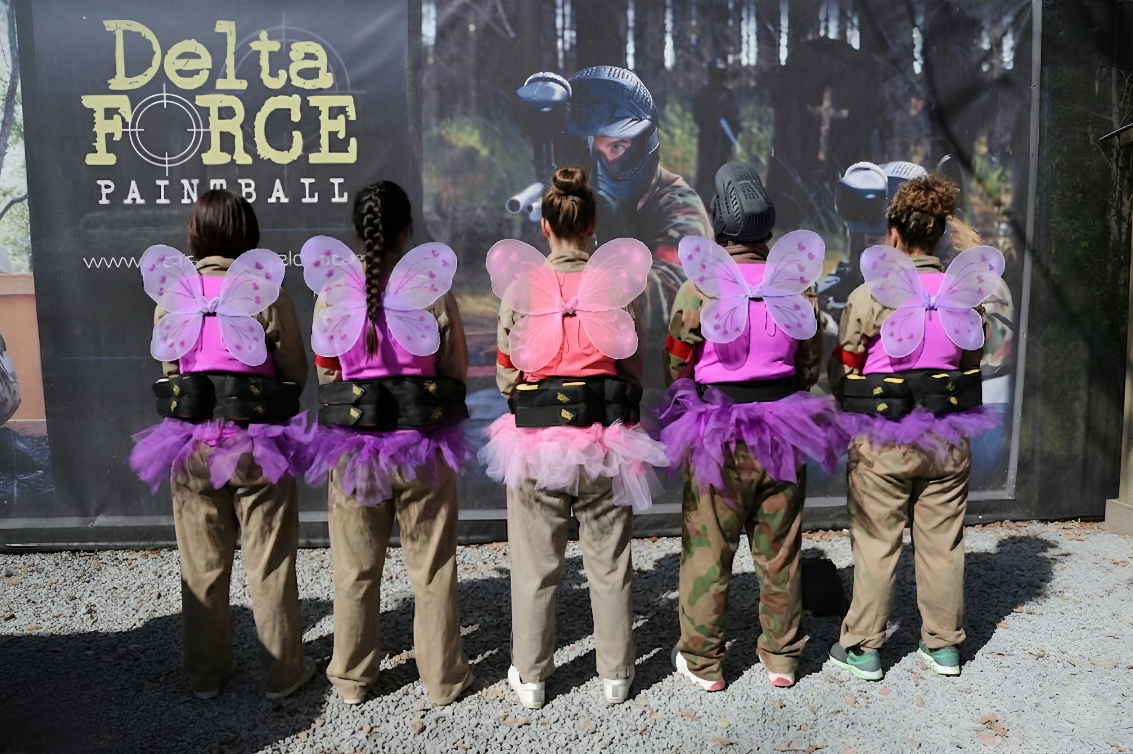 Hen party group wearing wings and tutus at Delta Force Paintball