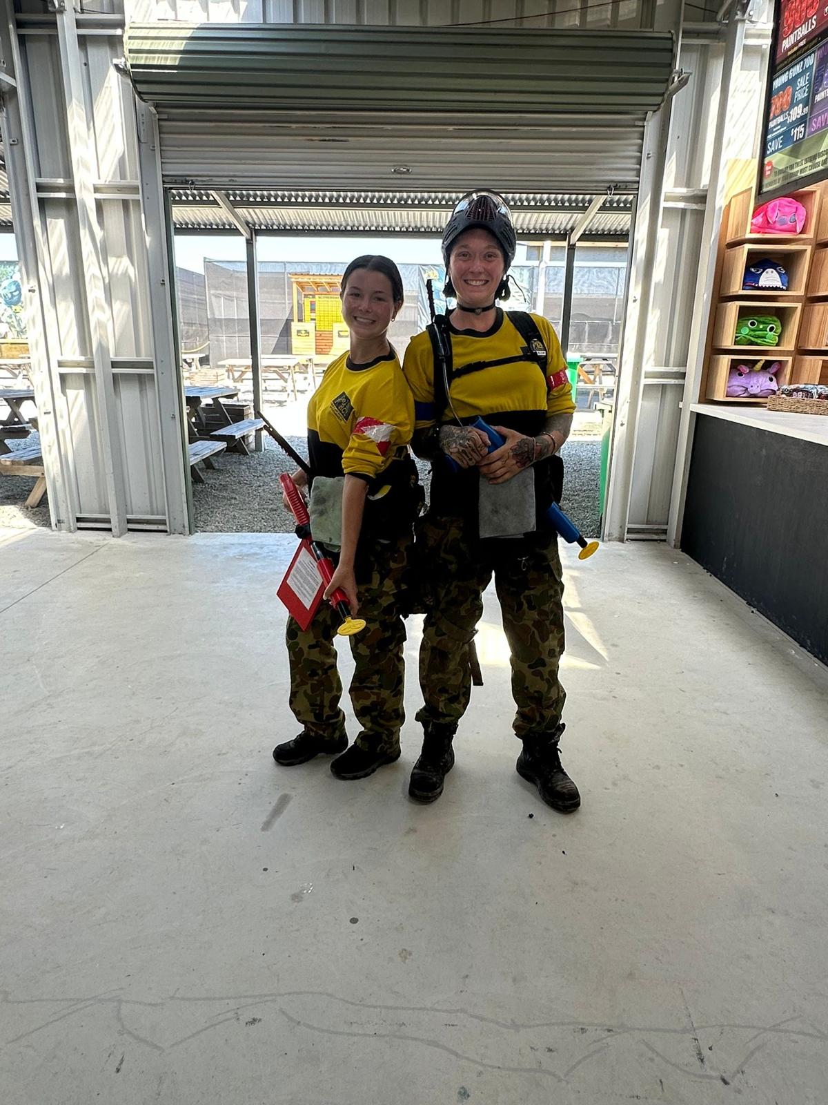 Paintball marshal helping players