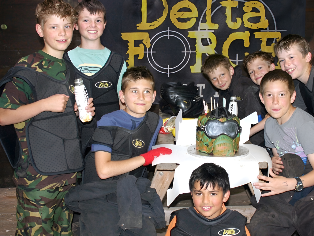 Kids celebrating a paintball birthday party
