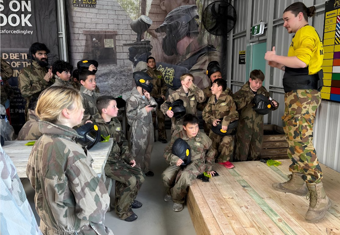 Kids paintball safety briefing before a party game