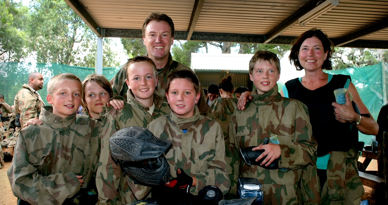 Family and children ready for paintballing
