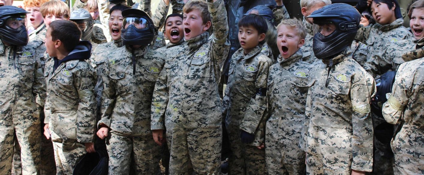 School paintball group cheering in camouflage kit
