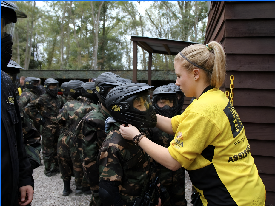 Marshal checking a school paintball player helmet