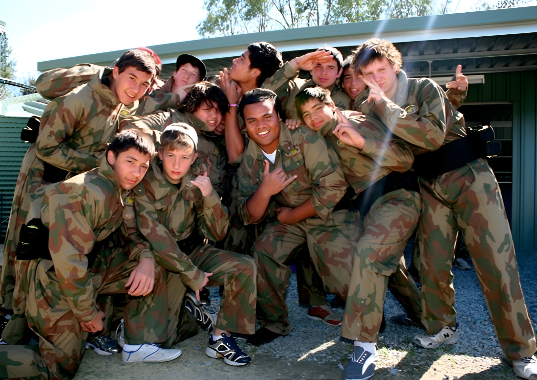 Scout group posing together in paintball kit