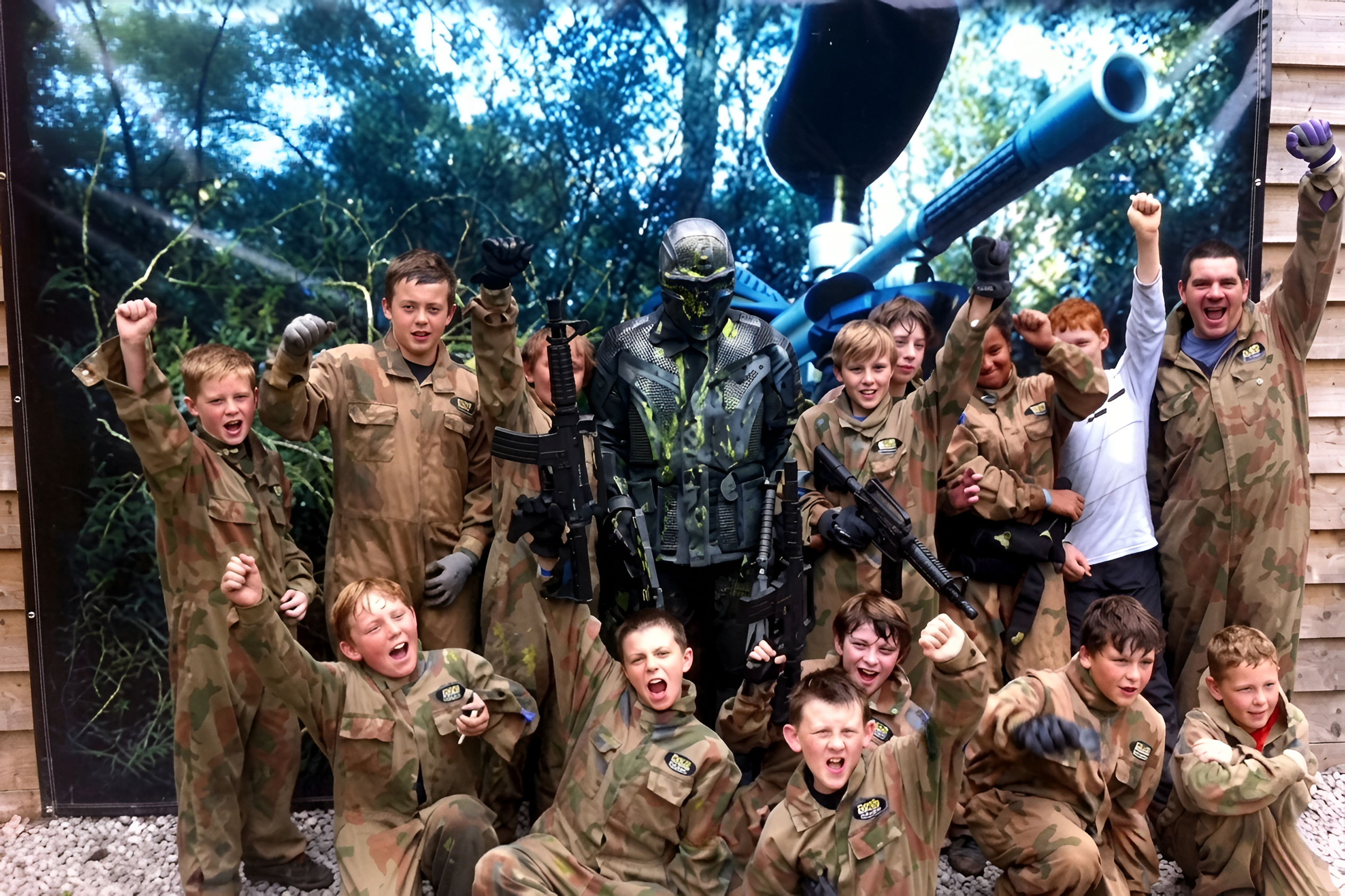 Scouts cheering with a Delta Force Paintball character