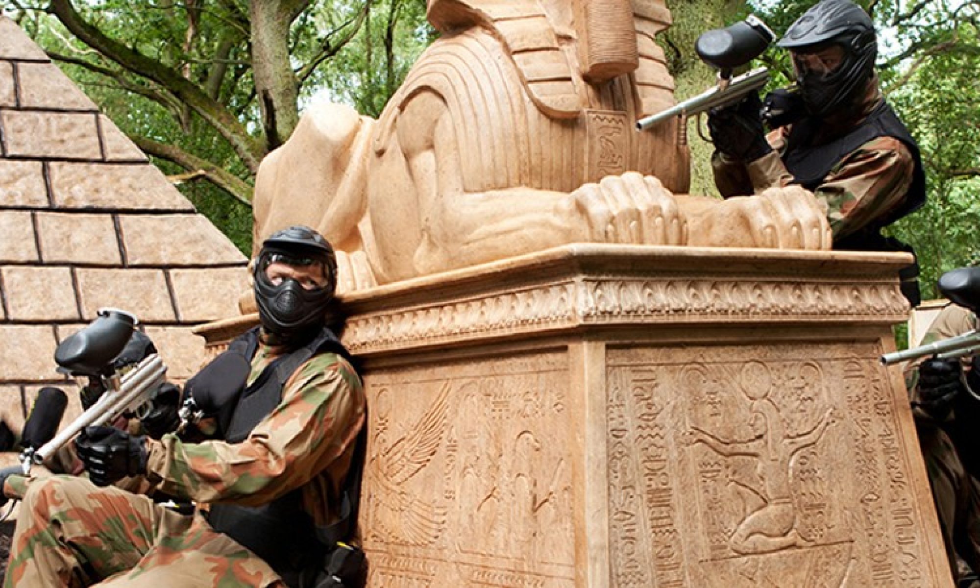 Players guarding a Tomb Raider game-zone structure