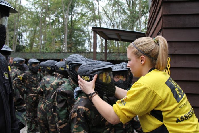 Delta Force marshal checks children's helmets