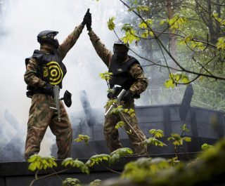 Delta Force Paintball Players High-Five