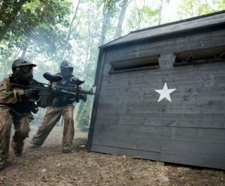 Two players advance around WWII bunker