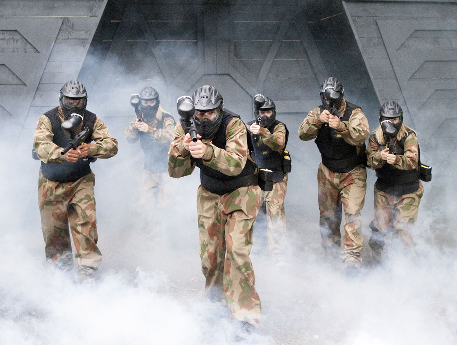 Squad of Paintball Players Advance from Space Warz Bunker