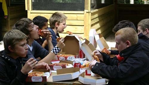 Kids Eating Pizza Lunch at Paintball Centre