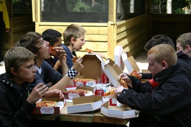 Kids Eating Pizza Lunch at Paintball Centre