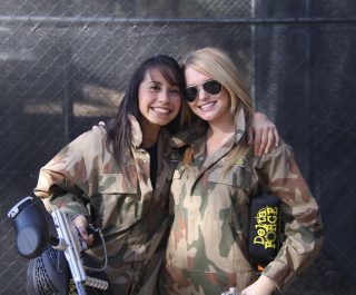 Two Girls Dressed In Camo Holding Delta Force Guns