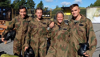 Friends smile at Delta Force base camp