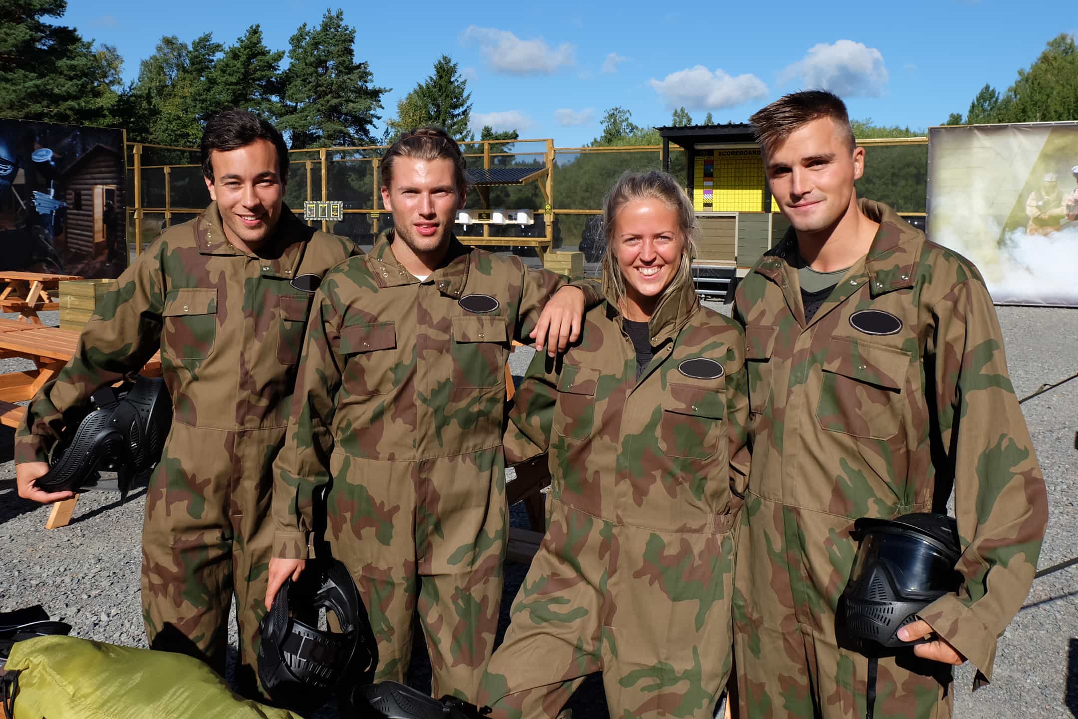 Friends smile at Delta Force base camp