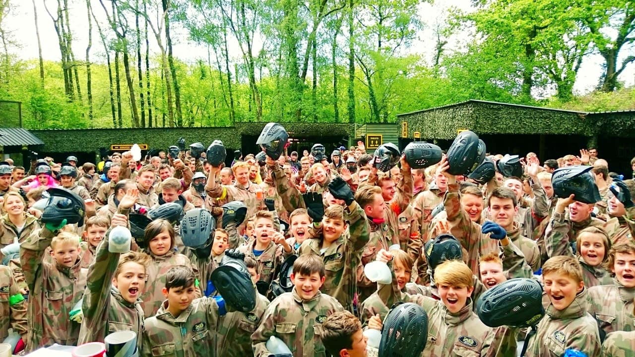 Paintball Players Raise Helmets in Celebration at Base Camp