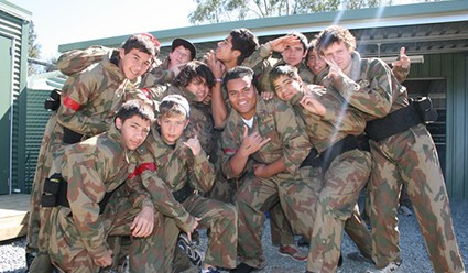 Kids throwing up gang signs at basecamp