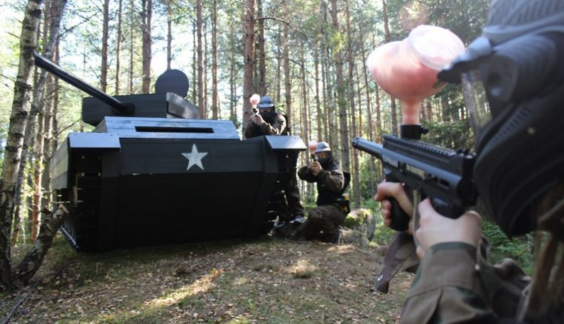 Paintball Players Exchange Fire Over a Tank