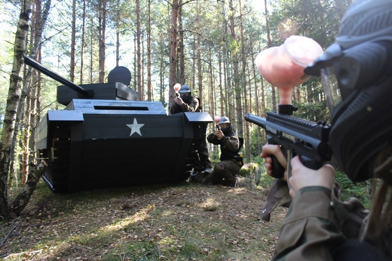 Paintball Players Exchange Fire Over a Tank