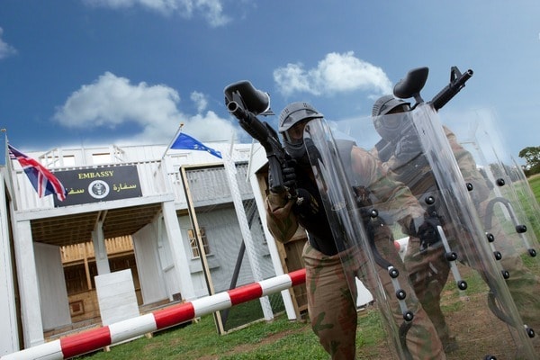 Paintball Players Defend the Embassy with Riot Shields