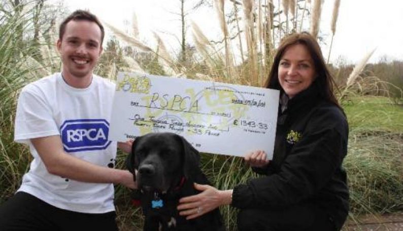 RSPCA Pose With Cheque Delta Force Paintball Staff And Dog