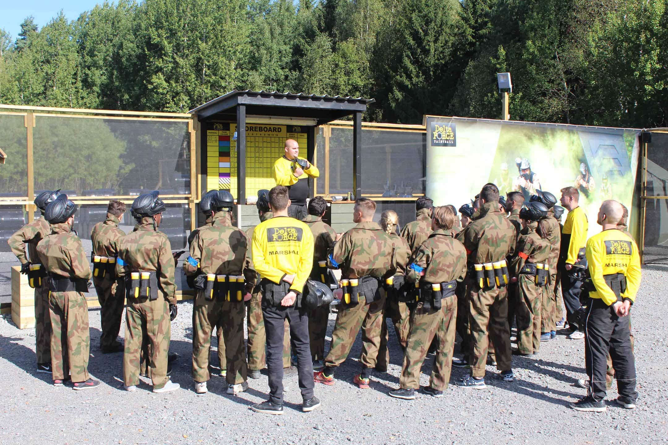 Marshal giving briefing at base camp