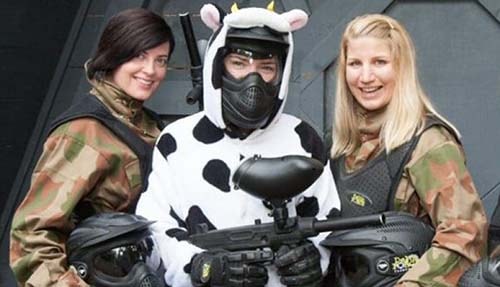 Bride in cow onesie poses with two friends