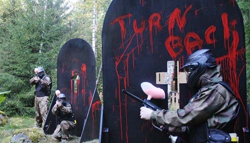 Paintball Players Exchange Fire Behind Bloody Gravestones