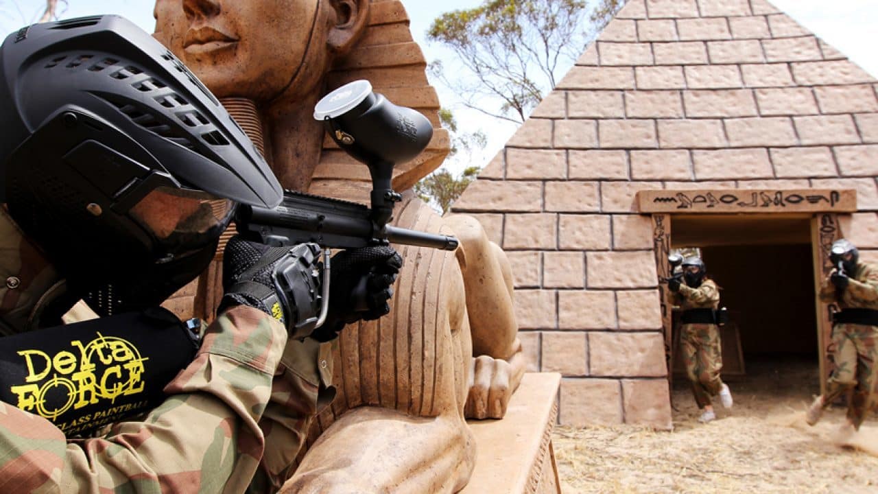 Paintball Player Aim At Opposition By Pyramid