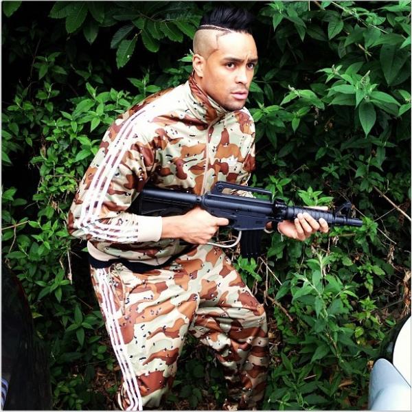 Ashley Banjo Poses In Camo Holding M16 Paintball Gun