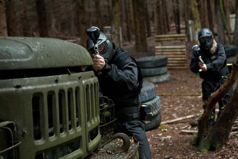 Two players advance behind armoured vehicle