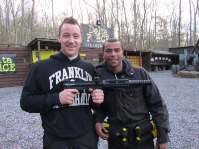 John Terry and Ashley Cole pose with paintball gun