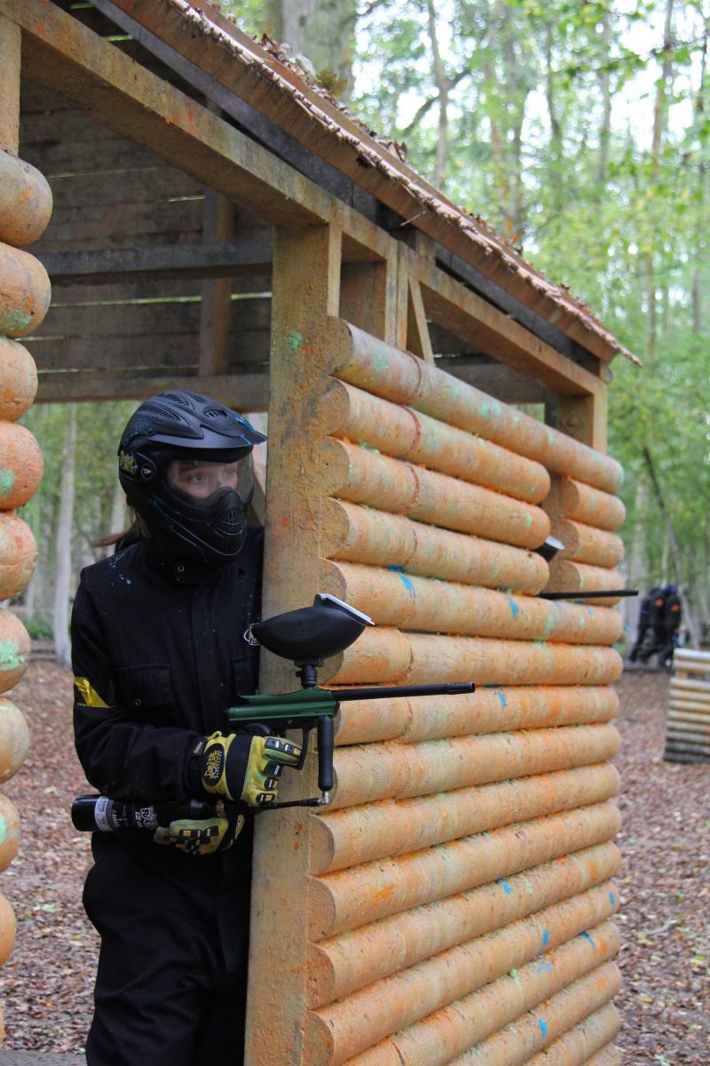 Player pokes gun round side of hut