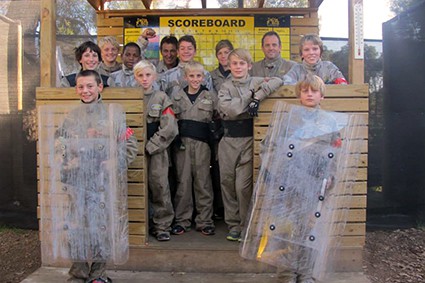 Scouts pose with paintball riot shields