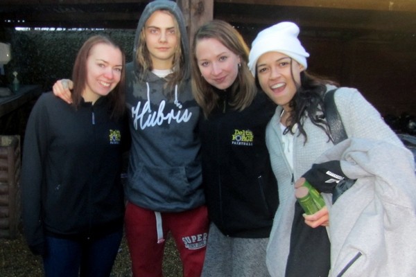 Cara Delevinge and Michelle Rodriguez with marshals