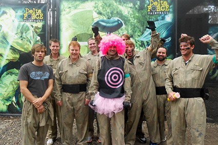 Groom in tutu poses with stag party