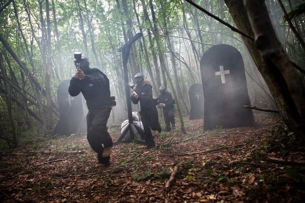 Three players sprint through graveyard