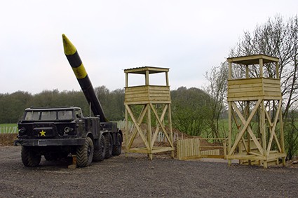 Scud missile beside two towers