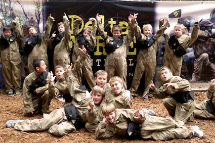 Scouts celebrate at Delta Force Paintball base camp