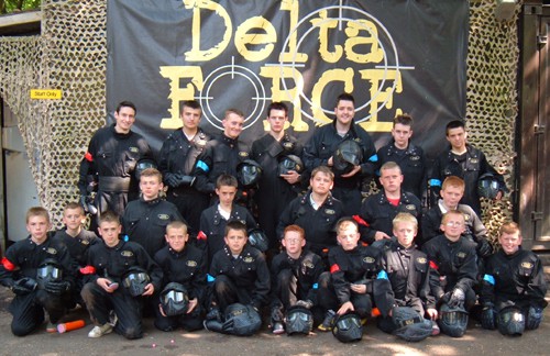 School class photo at Delta Force Paintball base camp