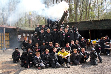 Kids pose with Howitzer gun at base camp