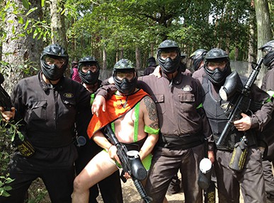 Stag party poses with groom in mankini