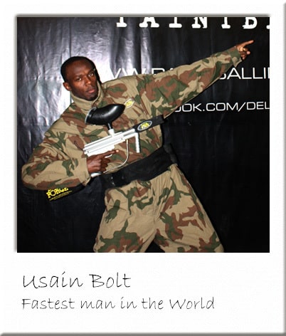 Usain Bolt Posing with a Paintball Gun