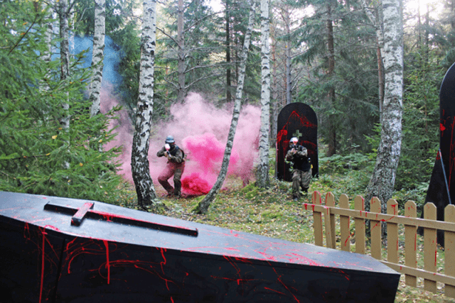 Two players move from smoke to blood-spattered coffin