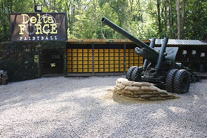 Howitzer gun behind sandbags in base camp