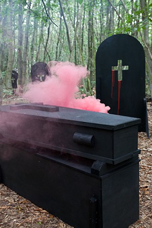 Coffins consumed by smoke