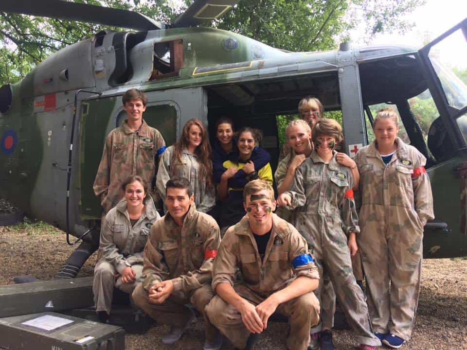 Group of Players in front of Helicopter in Paintballing Kegworth